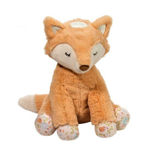 Stuffed fox on a white background. Fox is sitting and has floral pattern on paw with burnt orange fur for most of the body. The tale, the face and the ears are a natural color with a brown nose and black eyelashes. There is a round natural-colored flat circle at the top of the head.