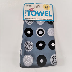 Gray Skoy dishtowel with package label on top. Circle pattern print on the solid gray colored in black, white and gray.