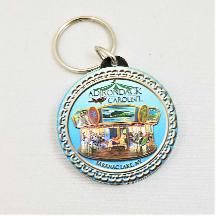 Adirondack Carousel logo on a pale blue circle with a silver key ring above it.