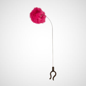 The kitty phone clip on a white background. Black U-shaped bottom clip with a thin metal wire coming out and bending at the top which holds a hot pink puff ball.