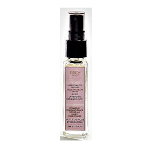 Single glass bottle of Earth Luxe Love Notes Aromatherapy spray standing upright. The top has a black spray dispenser seen through its plastic cover. A pale pink-colored vertical product label fills the front side of the bottle.
