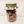 Side, standing view of  the clear part of the mason jar showing the maple dog biscuits inside with the fabric-lined top of jar also visible.