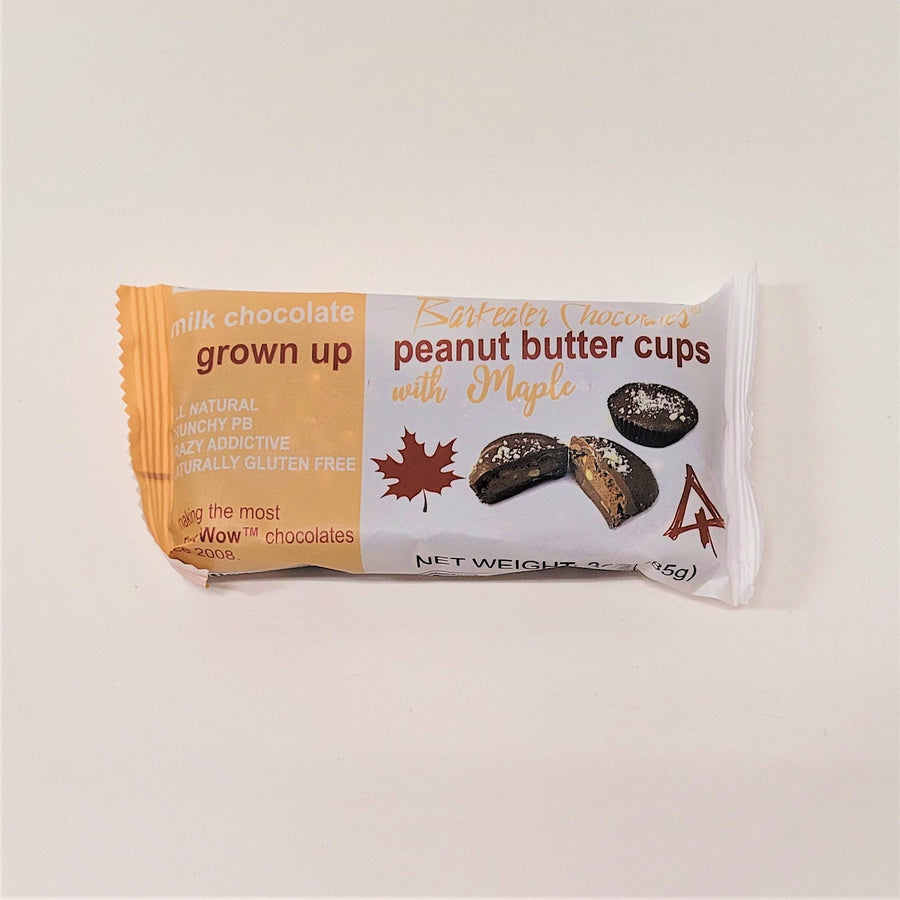 Yellow and white package of Milk Chocolate Barkeater chocolates peanut butter cups with maple.