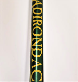 Close up of yellow text on the green pole.