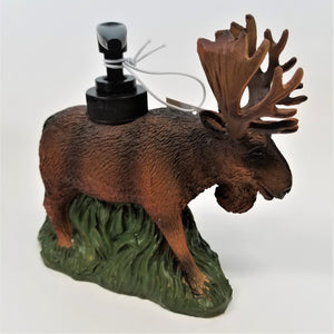 Brown textured moose with a black pump spout in its back. The moose's antlers are facing right and it is standing on a green-textured bottom.