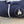 Close up of top navy hoodie folded to see the white Eagle Island logo close on the right side.