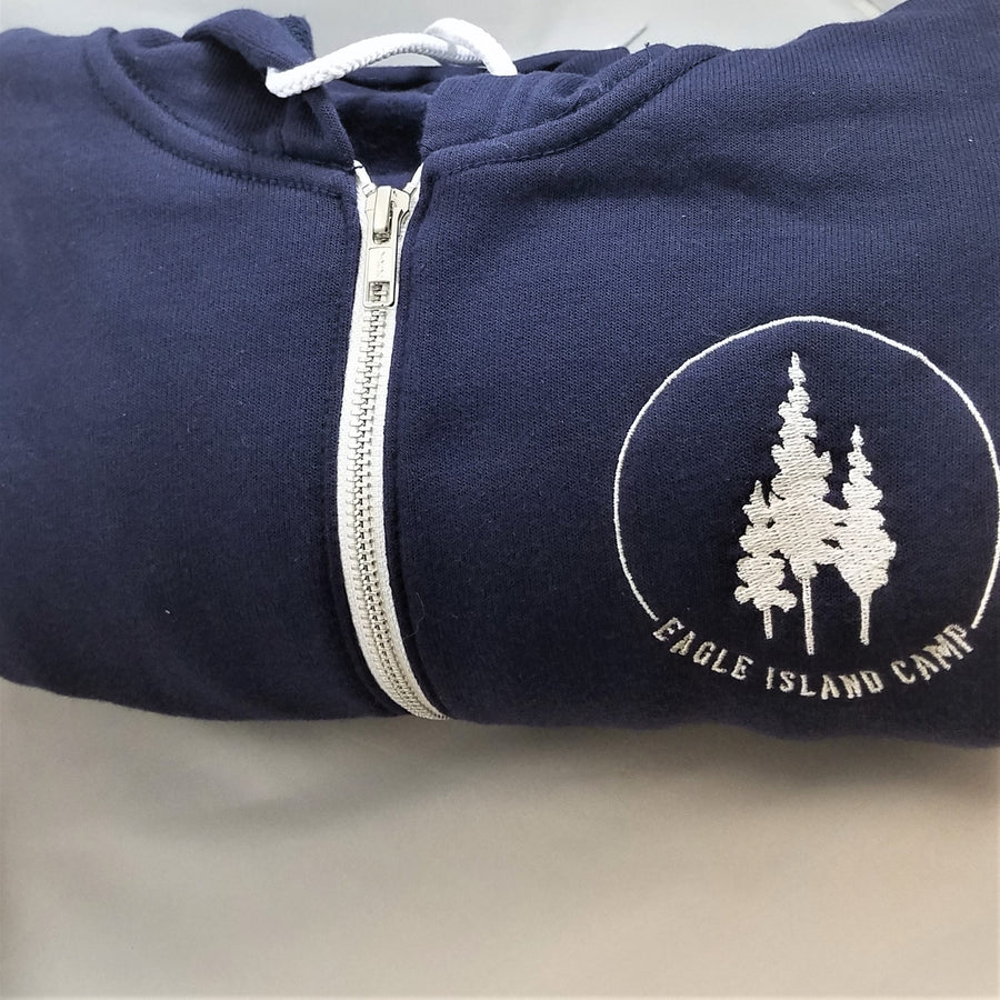 Close up of top navy hoodie folded to see the white Eagle Island logo close on the right side. 