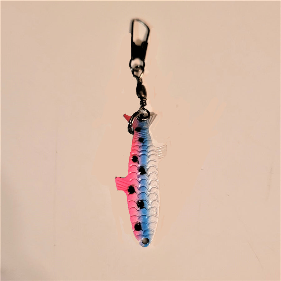 Fishing lure zipper pull with fish in pink, blue and white with black dots on the left side in the pink and blue sections.