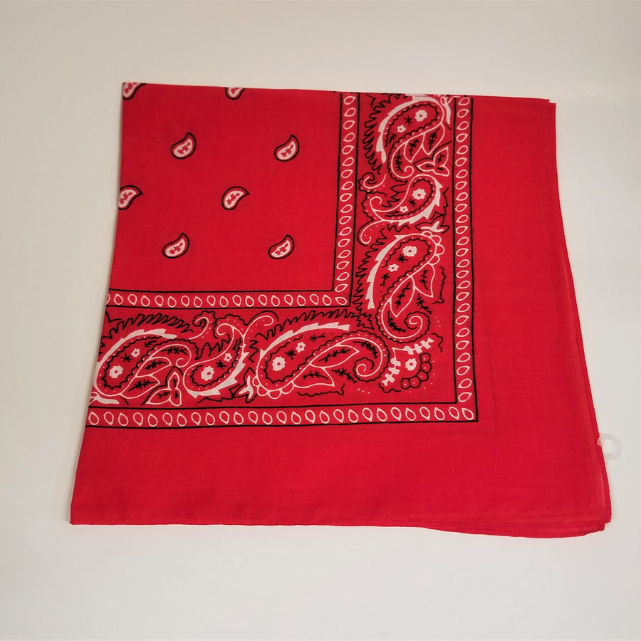 Workman's red bandana folded square with paisley white and black print around corner edge