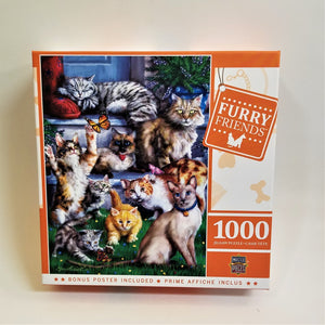 Box cover of 1000-piece Furry Friends (feline) puzzle. Ten cats in various positions look out along with a couple of butterflies. Black and white, beiges, gold, grays on a green lawn under some and some resting on bluish white steps.