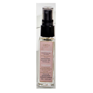 Single glass bottle of Earth Luxe Rejuvenate Aromatherapy spray standing upright. The top has a black spray dispenser seen through its plastic cover. A pale pink-colored vertical product label fills the front side of the bottle.