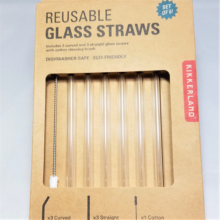 Box of reusable glass straws with the straws and cleaner showing through the packaging window.