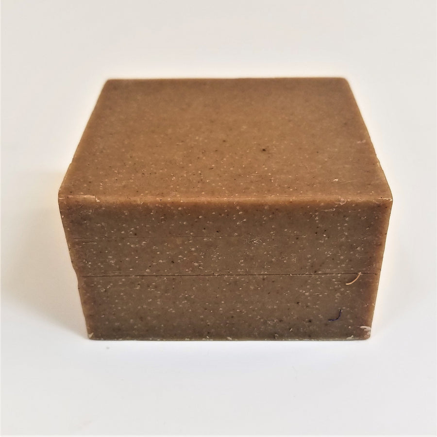 Brown soap bar square with tiny off-white speckles.