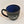 Black bistro mug seen from above with blue interior prominent over the white lettered graphic of the black front of the mug