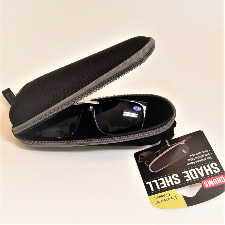 Open black sunglass case with gray zip trim. Top is open upward and the bottom is flat with black sunglasses sitting in the case.