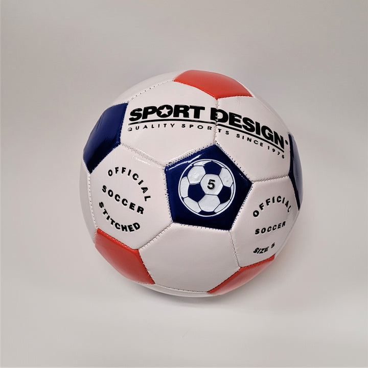 Red, white and blue soccer ball on a white background. Black type on top white section says SPORT DESIGN in large type with small type underneath: QUALITY SPORTS SINCE 1976. Center blue section has a blue and white soccer ball picture with the number 5 in the center. White sectdion on left bottom says: OFFICIAL SOCCER STITCHED. White section bottom right says: OFFICIAL SOCCER SIZE 5.