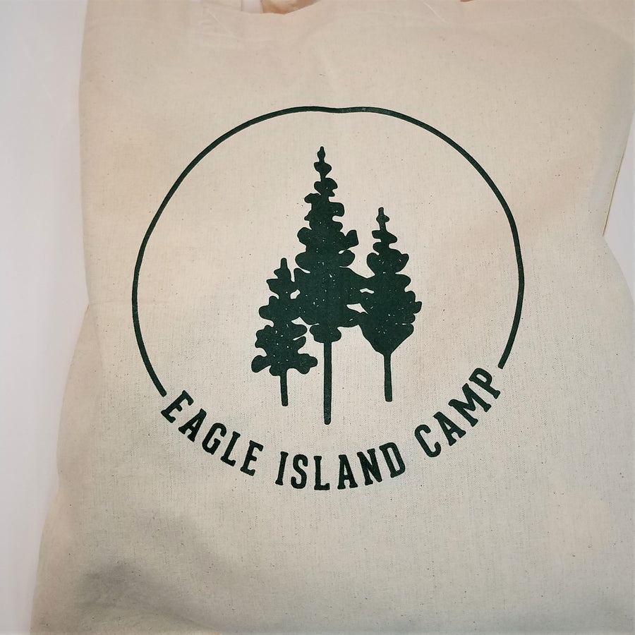 Close up of green Eagle Island logo on the cream-colored tote.