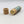 Vapor rub lying with its circular cylinder open to see what's inside the tube.